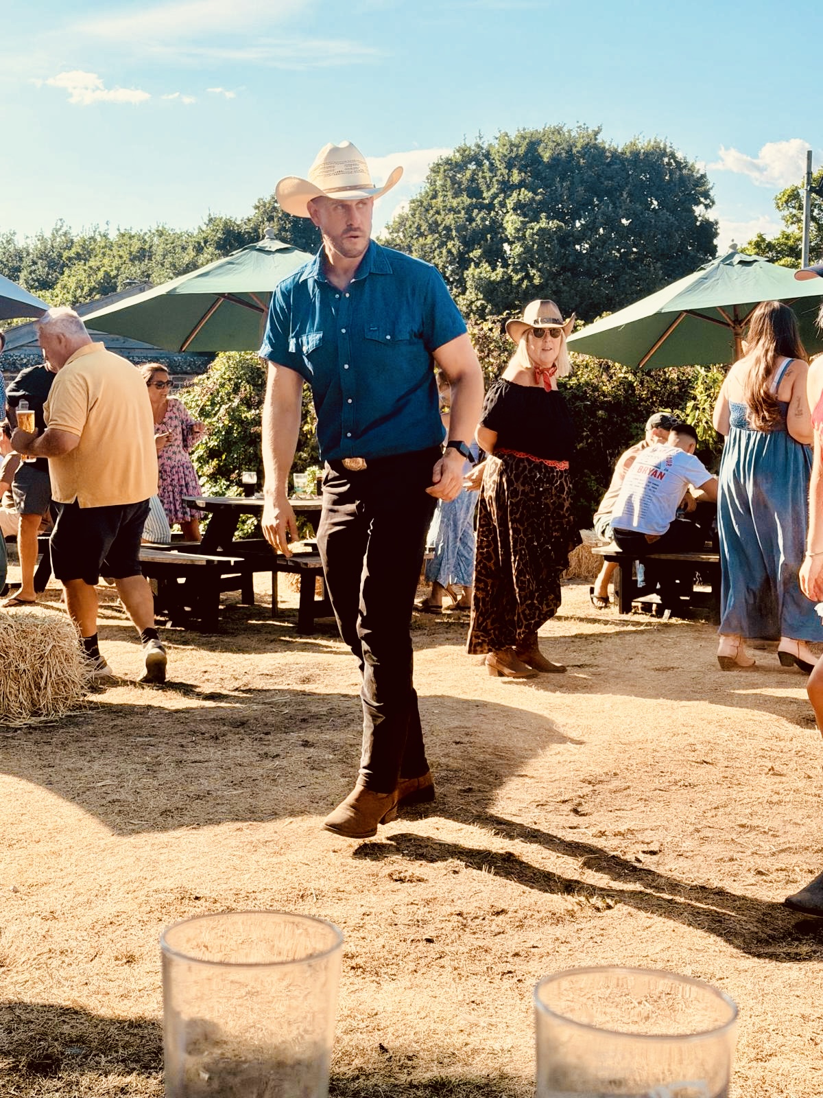 Dan Waterman line dancing at an outdoor country event